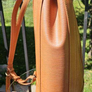 Back of the Louis Vuitton Epi Randonnee PM showing the leather backpack straps