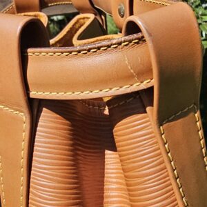 Top of the Louis Vuitton Epi Randonnee PM with the drawstring cinch and straps