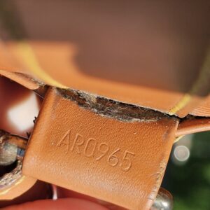 Date code AR0965 stamped inside the Louis Vuitton Epi Randonnee PM