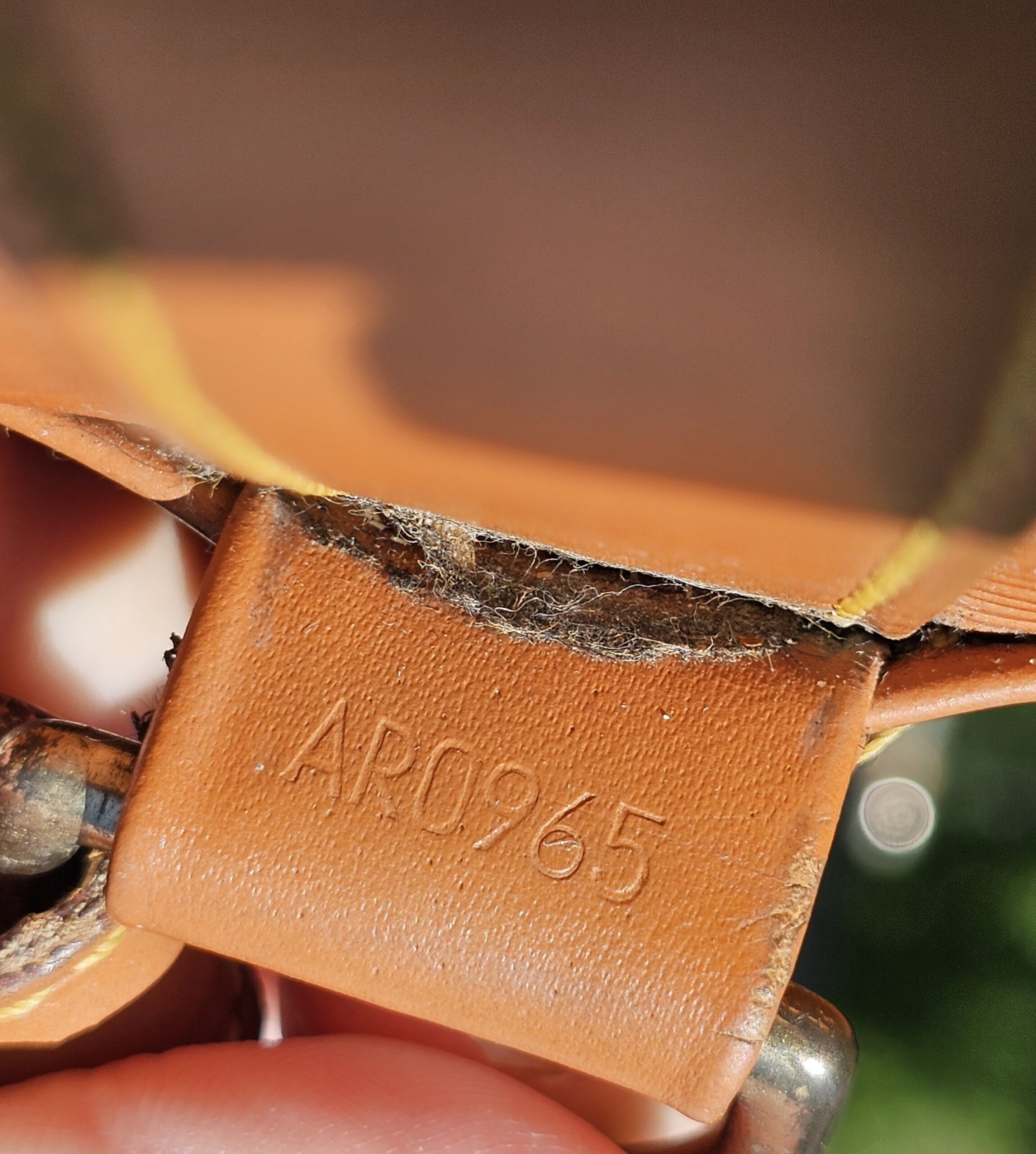 Date code AR0965 stamped inside the Louis Vuitton Epi Randonnee PM
