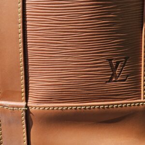 LV embossed on the Cipango Gold Epi kisslock wallet included with the Randonnee PM