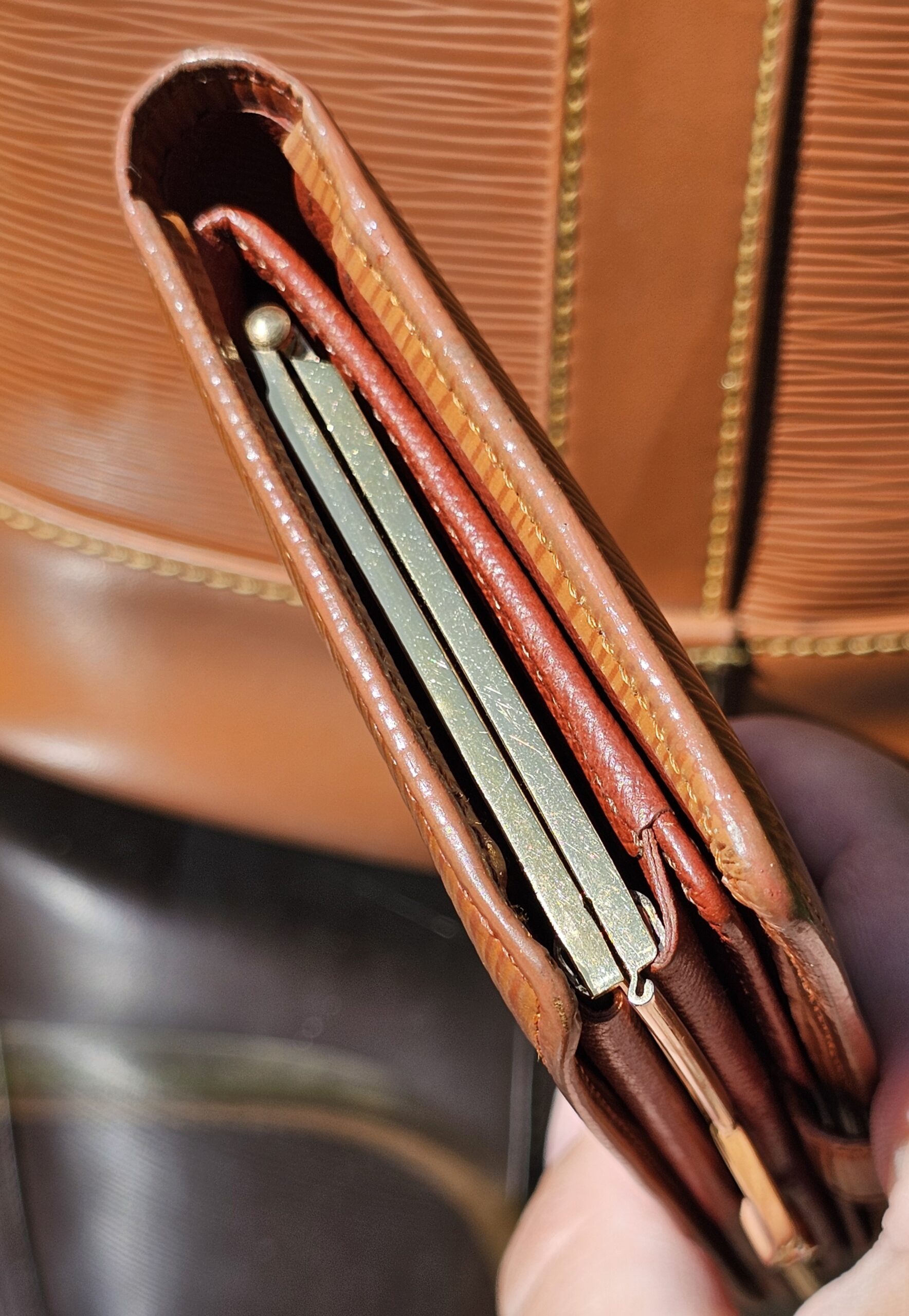 Card slots inside the Louis Vuitton Epi kisslock wallet