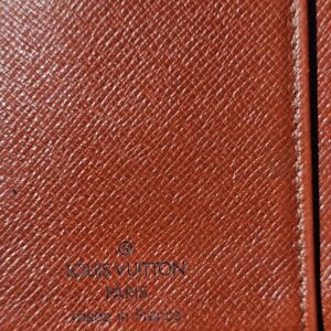 Louis Vuitton Paris made in France heat stamp inside the Epi kisslock wallet