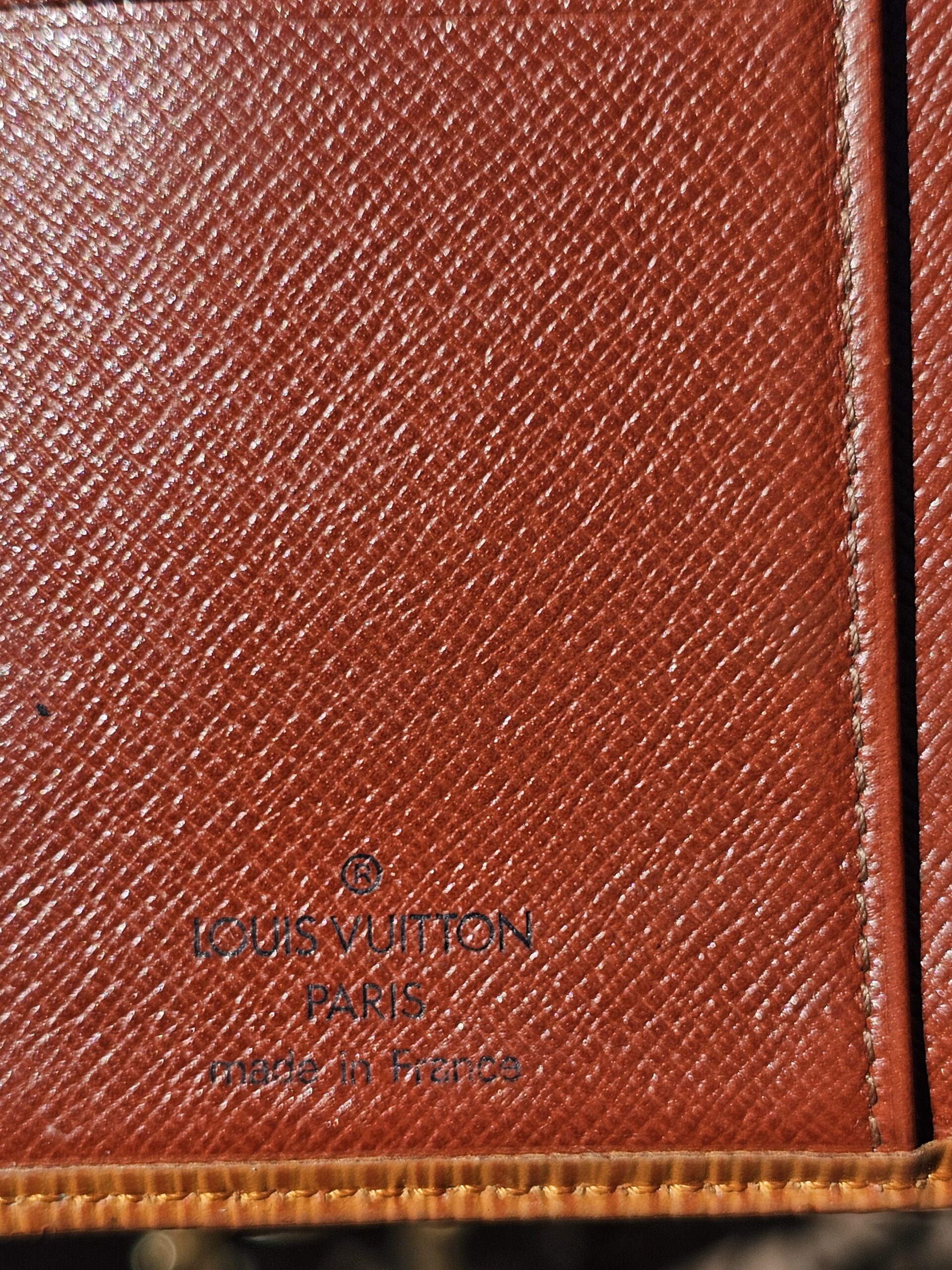 Louis Vuitton Paris made in France heat stamp inside the Epi kisslock wallet