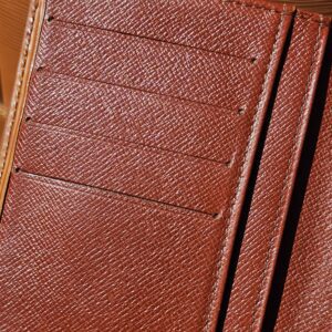 Card pockets and Louis Vuitton stamp inside the Epi kisslock wallet