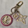 Louis Vuitton Colorline key holder and bag charm with a pink resin LV medallion, floral charm and gold-tone Monogram flower