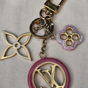 Full view of the Louis Vuitton Colorline bag charm showing the chain, clasp and all three charms