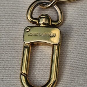 Gold-tone lobster clasp stamped Louis Vuitton on the Colorline key holder and bag charm