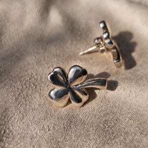 Chanel four leaf clover stud earring shown with its pierced post