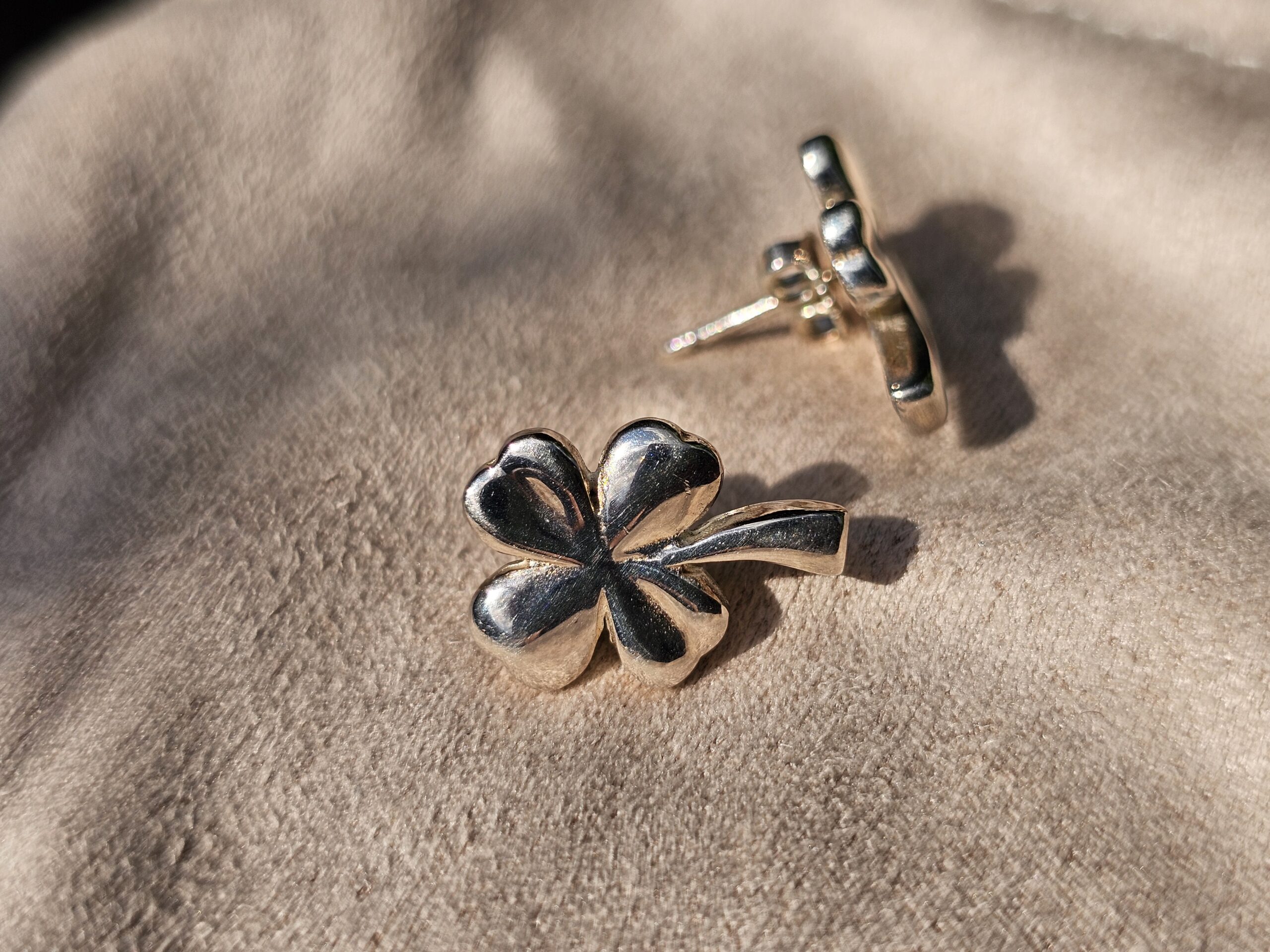 Chanel four leaf clover stud earring shown with its pierced post