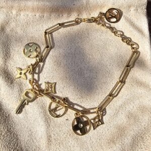 Full view of the Louis Vuitton Sweet Monogram bracelet showing the link chain, charms and extender