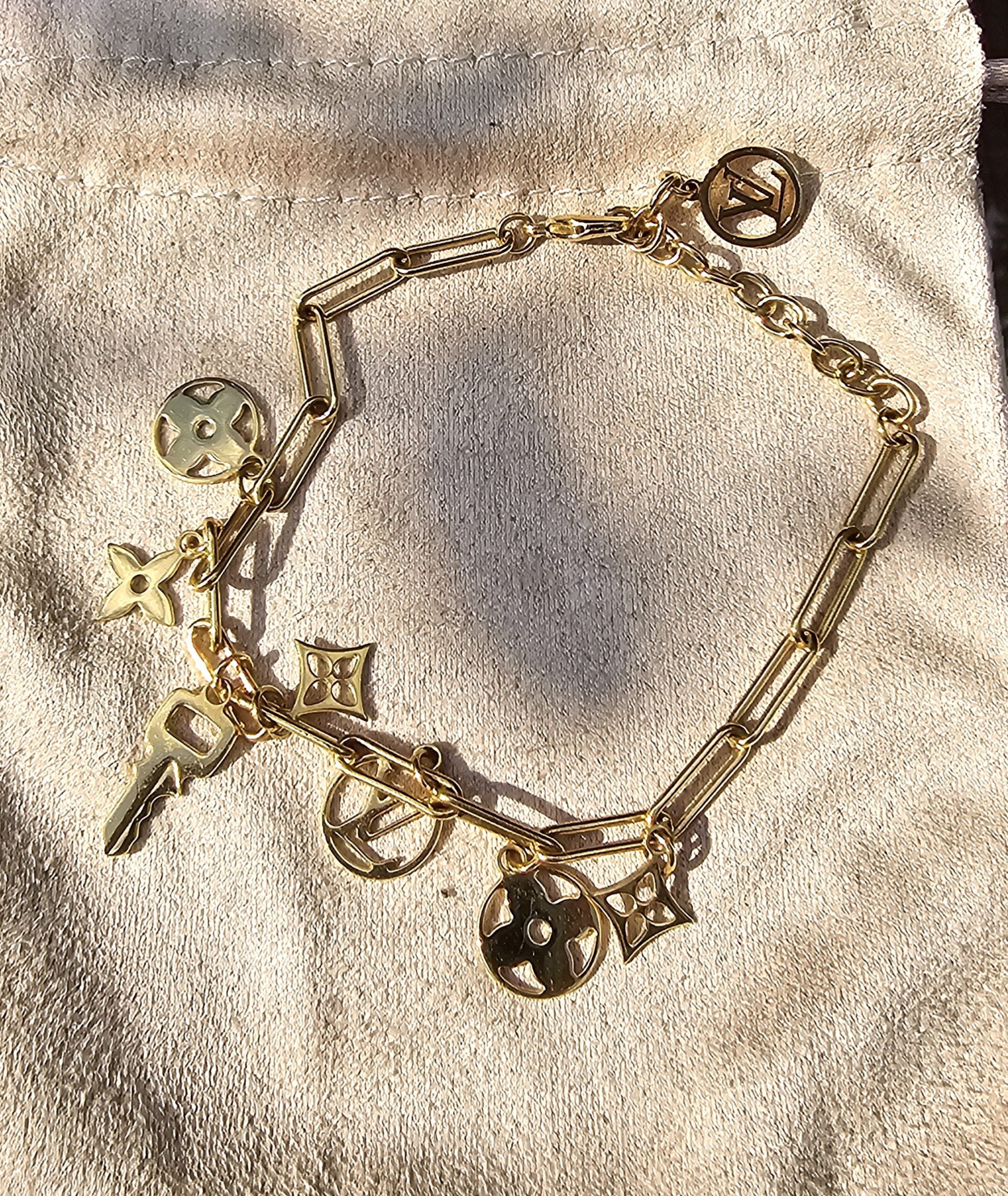 Full view of the Louis Vuitton Sweet Monogram bracelet showing the link chain, charms and extender