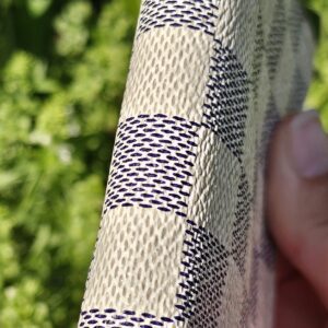 Side profile of the Louis Vuitton Damier Azur Zippy Coin Purse