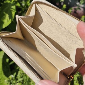Accordion-style interior of the Louis Vuitton Damier Azur Zippy Coin Purse with card slots and compartments