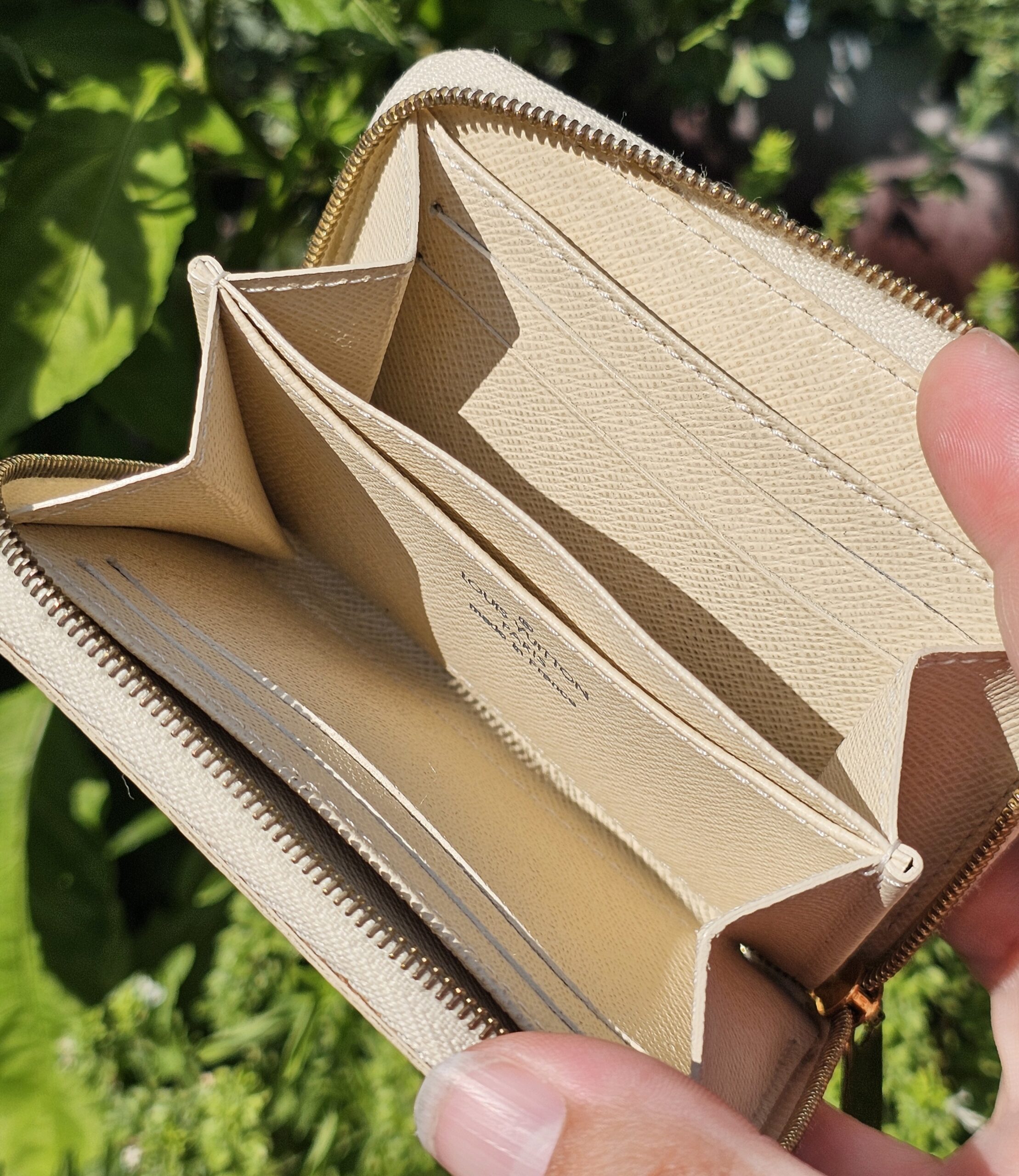 Accordion-style interior of the Louis Vuitton Damier Azur Zippy Coin Purse with card slots and compartments