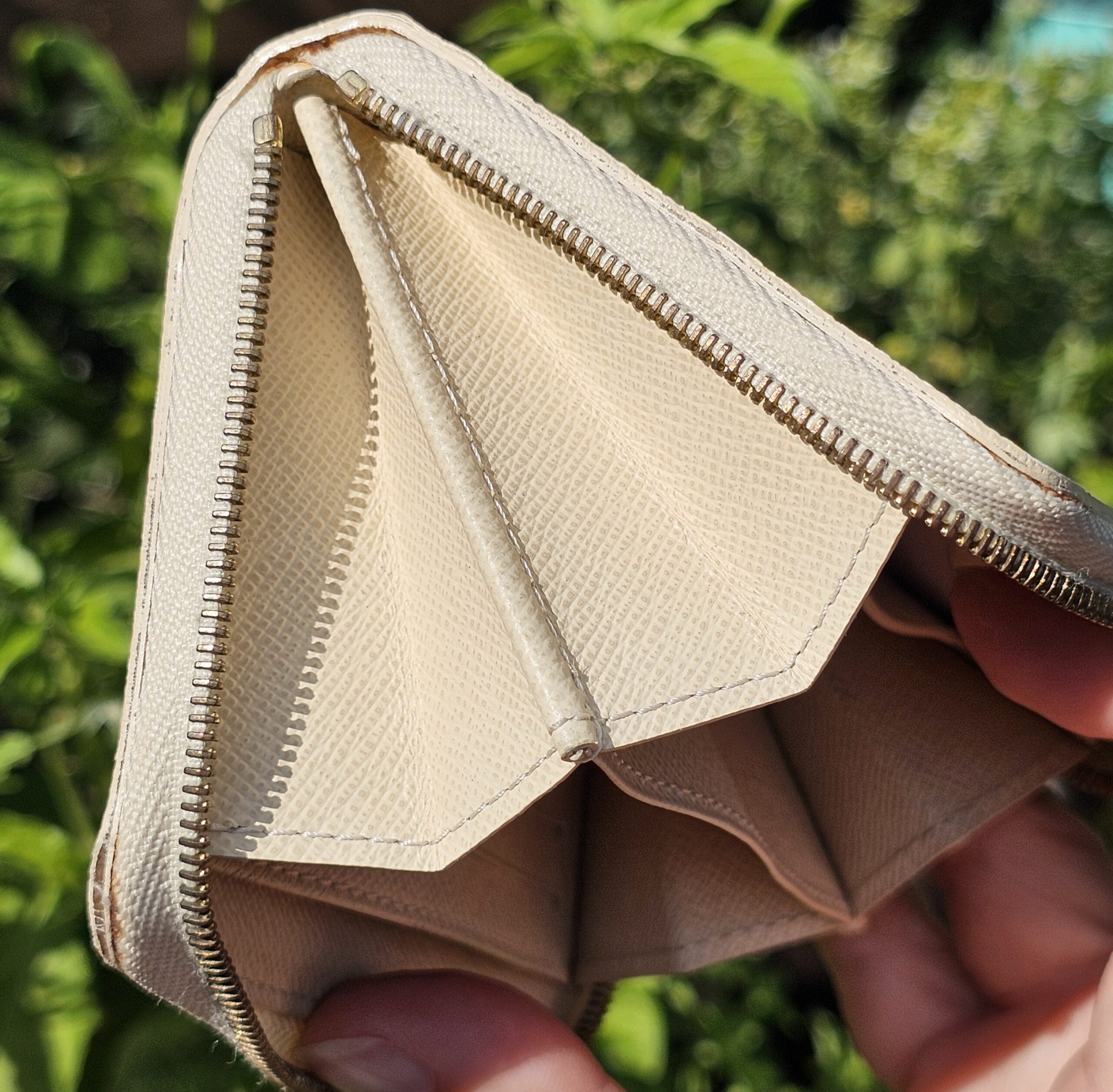 Louis Vuitton Damier Azur Zippy Coin Purse opened to show the accordion compartments