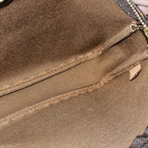 Clean brown textile lining inside the Louis Vuitton Graffiti Pochette Accessoires