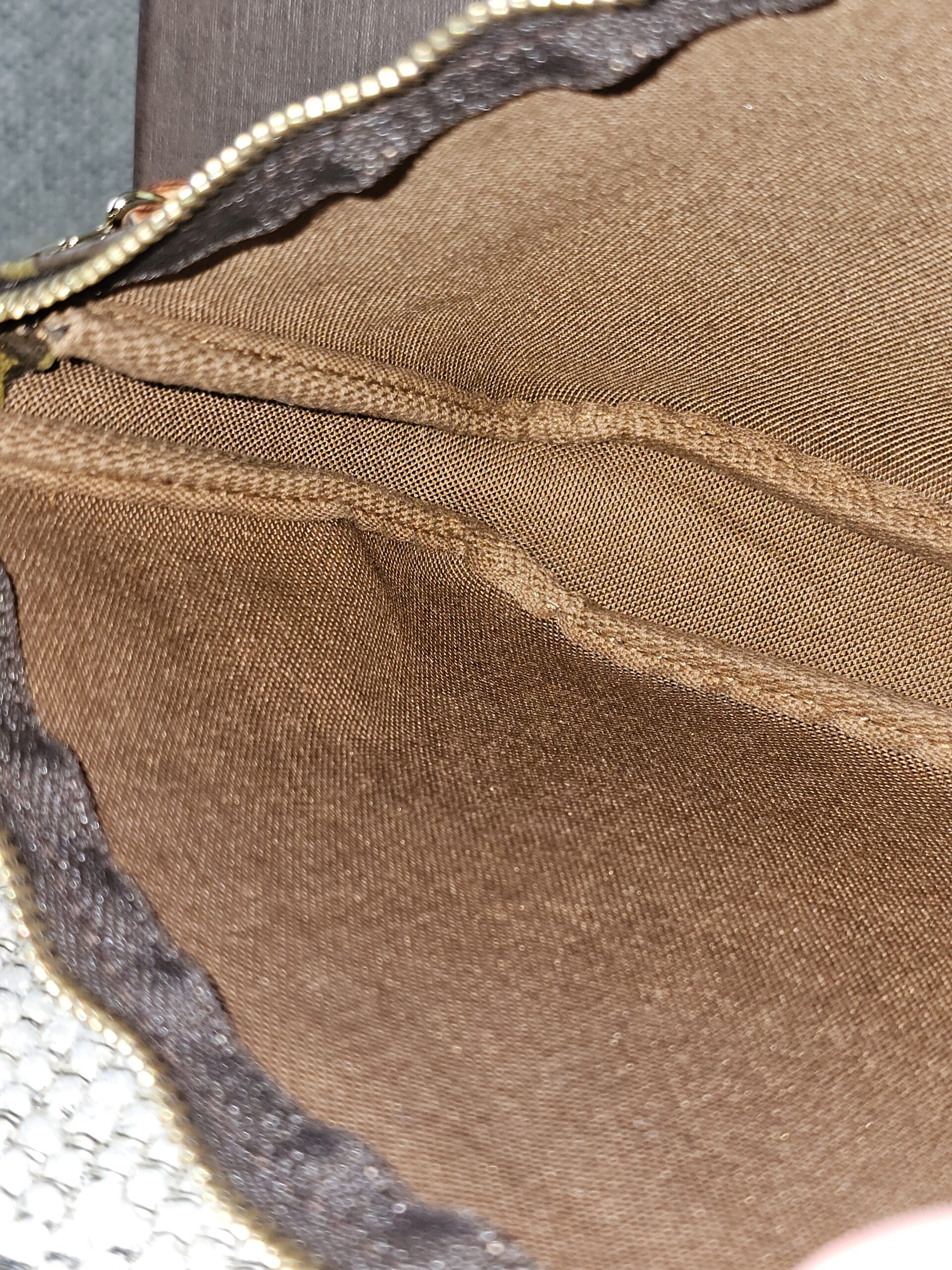 Louis Vuitton Graffiti Pochette Accessoires held open showing the interior