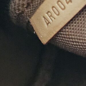 Date code AR0041 stamped inside the Louis Vuitton Stephen Sprouse Graffiti Pochette Accessoires
