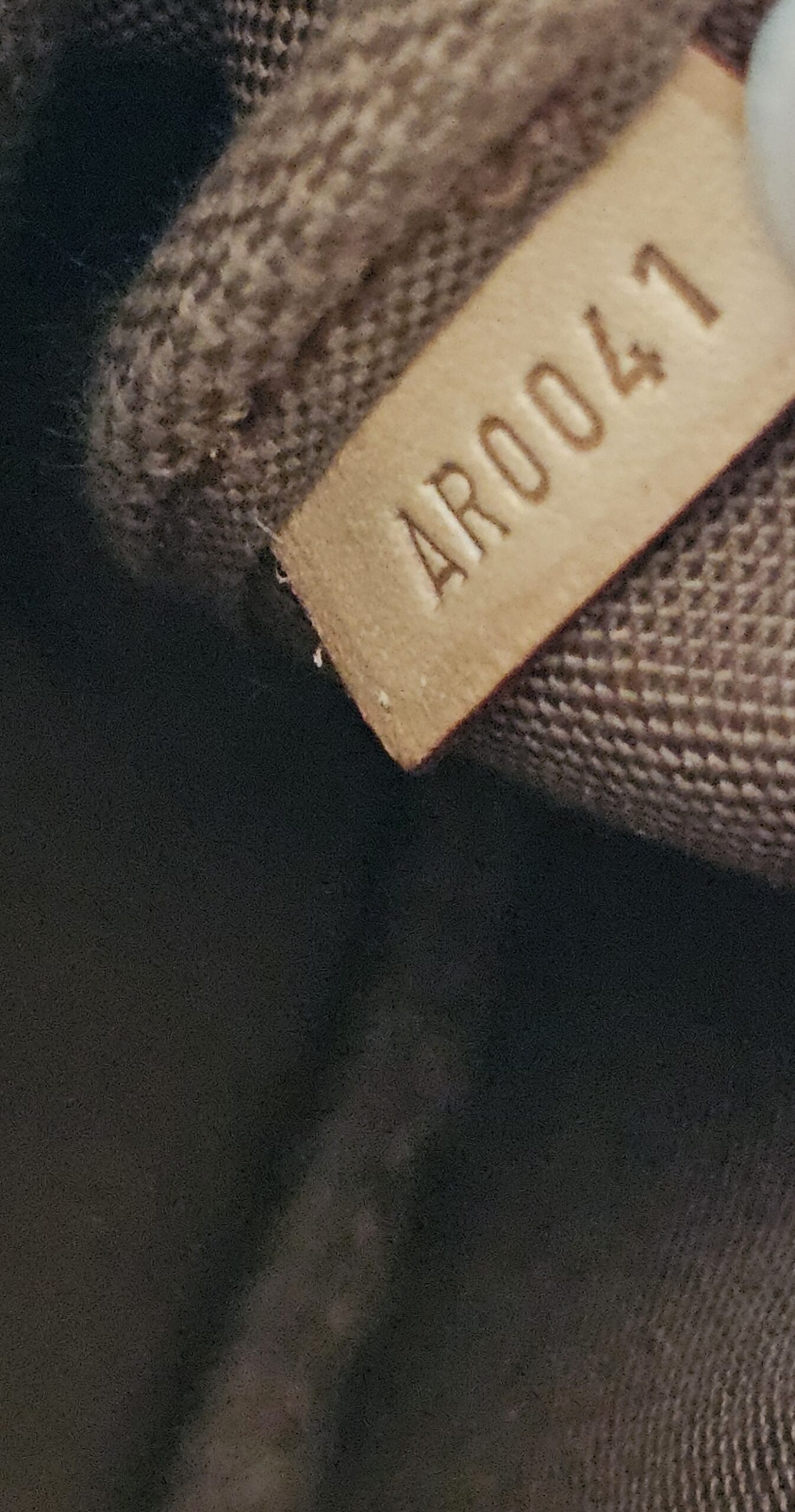 Date code AR0041 stamped inside the Louis Vuitton Stephen Sprouse Graffiti Pochette Accessoires