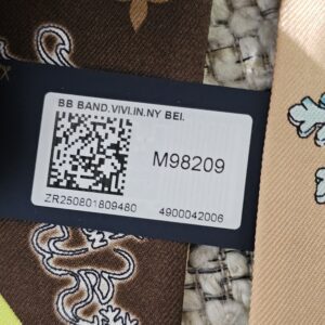 Retail tag for the Louis Vuitton bandeau reading BB BAND VIVI IN NY with style number M98209