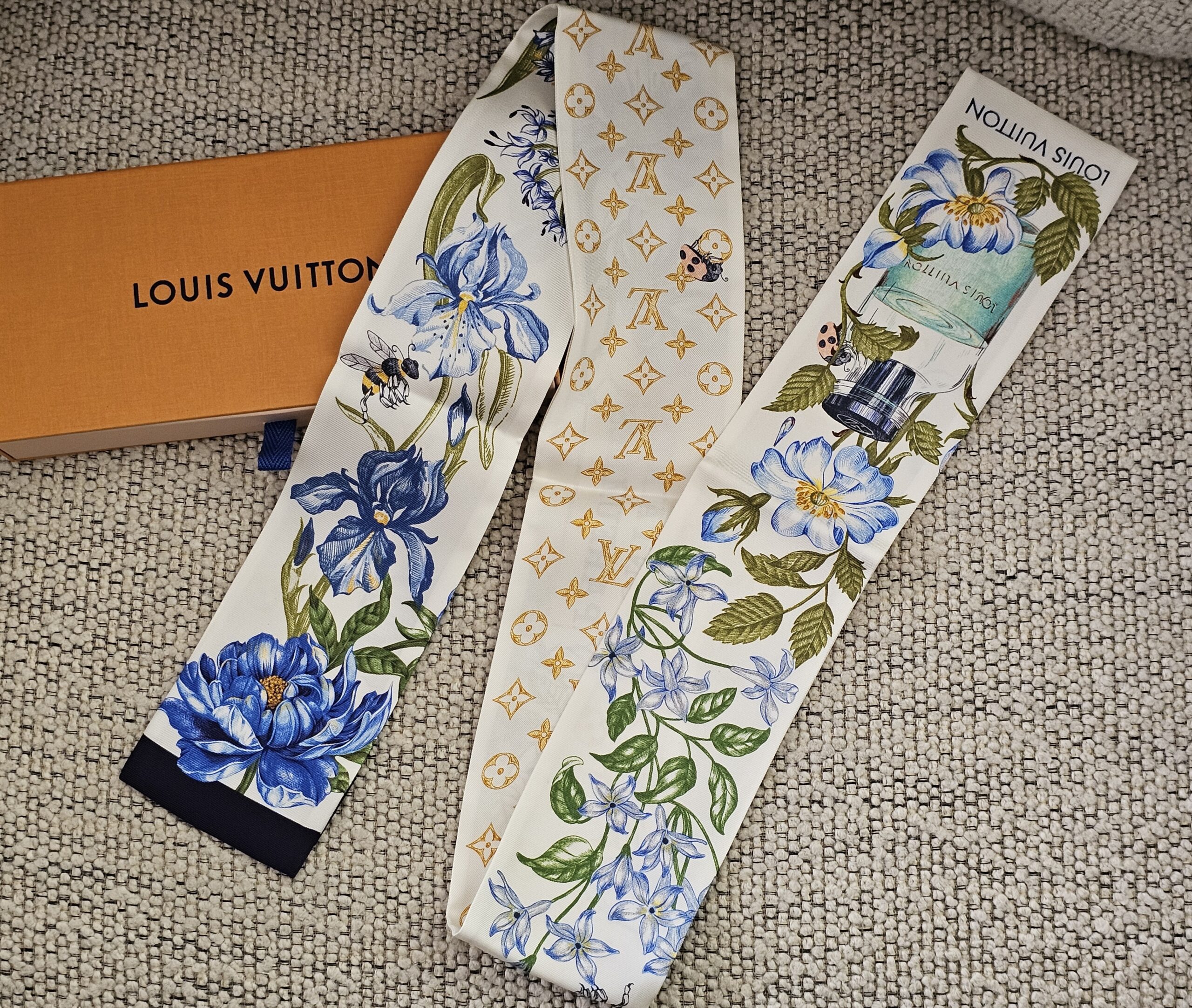 Louis Vuitton Fontaines Parfumees silk bandeau in blue florals and gold Monogram, shown with its Louis Vuitton box