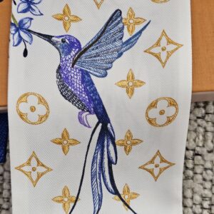 Blue hummingbird and flower printed on the Louis Vuitton Fontaines Parfumees silk bandeau