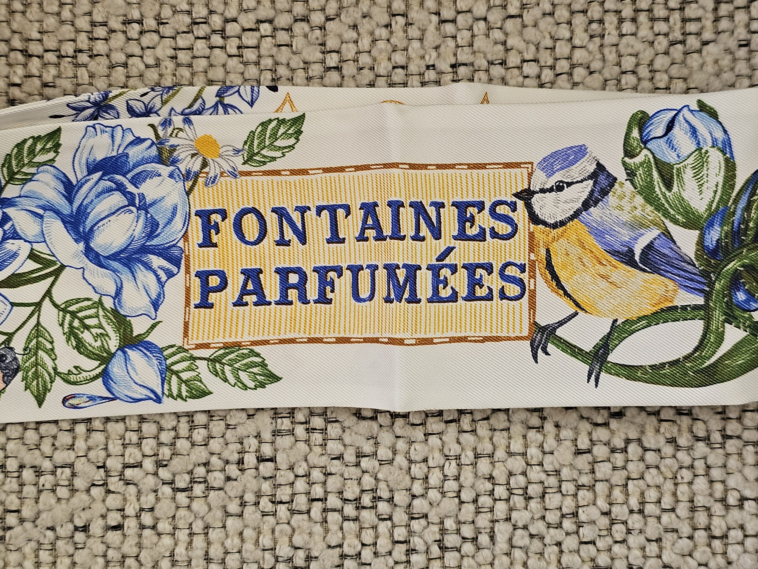 Fontaines Parfumees lettering printed on the Louis Vuitton silk bandeau