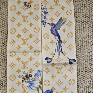 Gold Monogram side of the Louis Vuitton Fontaines Parfumees bandeau with hummingbird and florals
