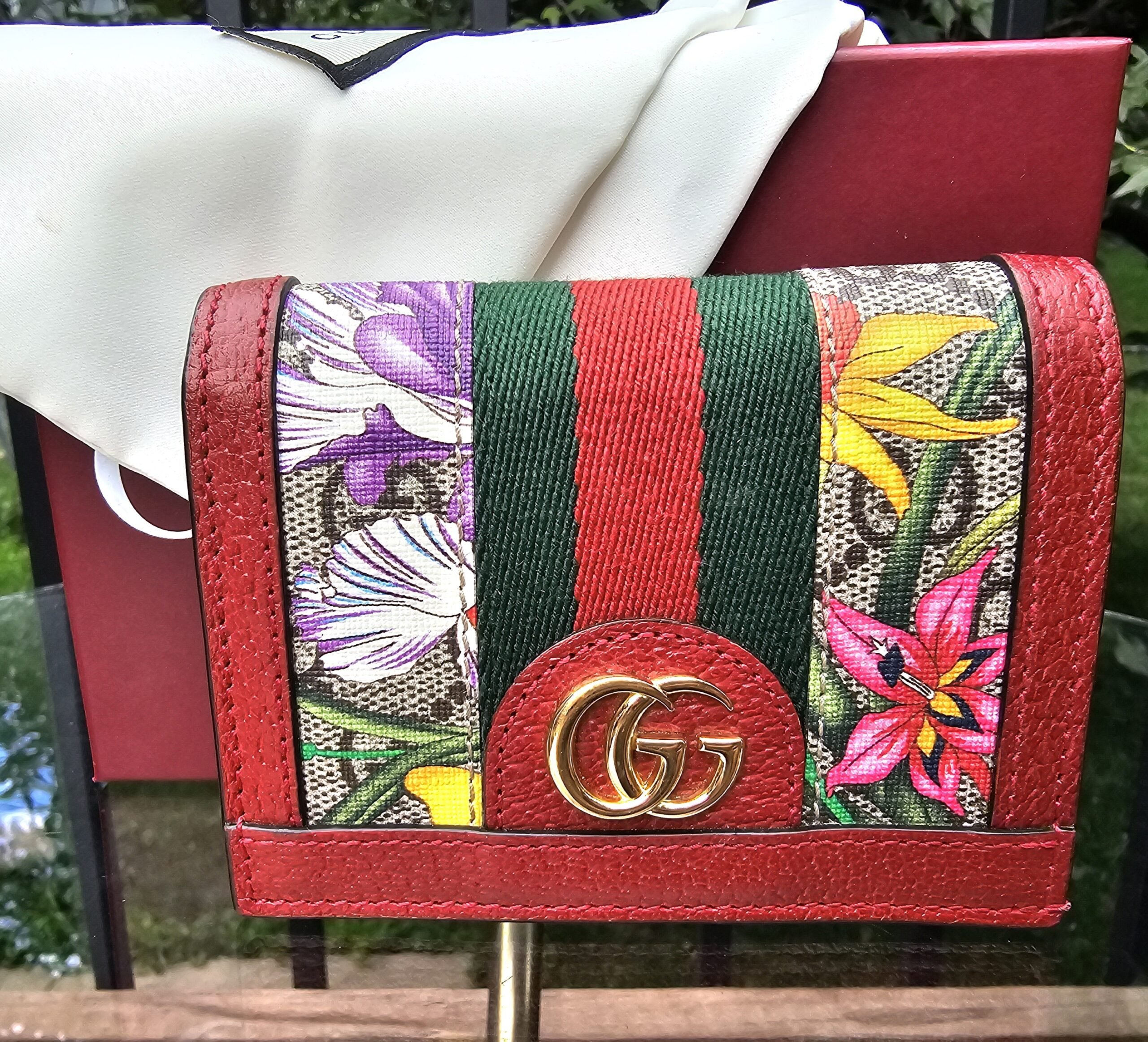 Gucci Ophidia compact wallet in GG Supreme Flora canvas with red leather trim, green and red Web stripe and gold Double G hardware
