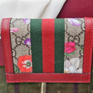 Back of the Gucci Ophidia compact wallet showing the GG Supreme canvas with Flora floral print