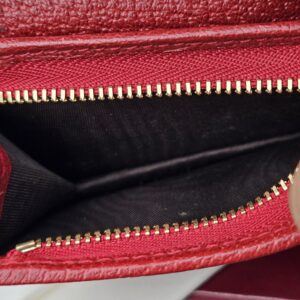 Zippered coin pocket inside the Gucci Flora Ophidia compact wallet