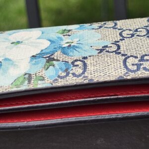 Side profile of the Gucci Blooms compact wallet showing the folded depth