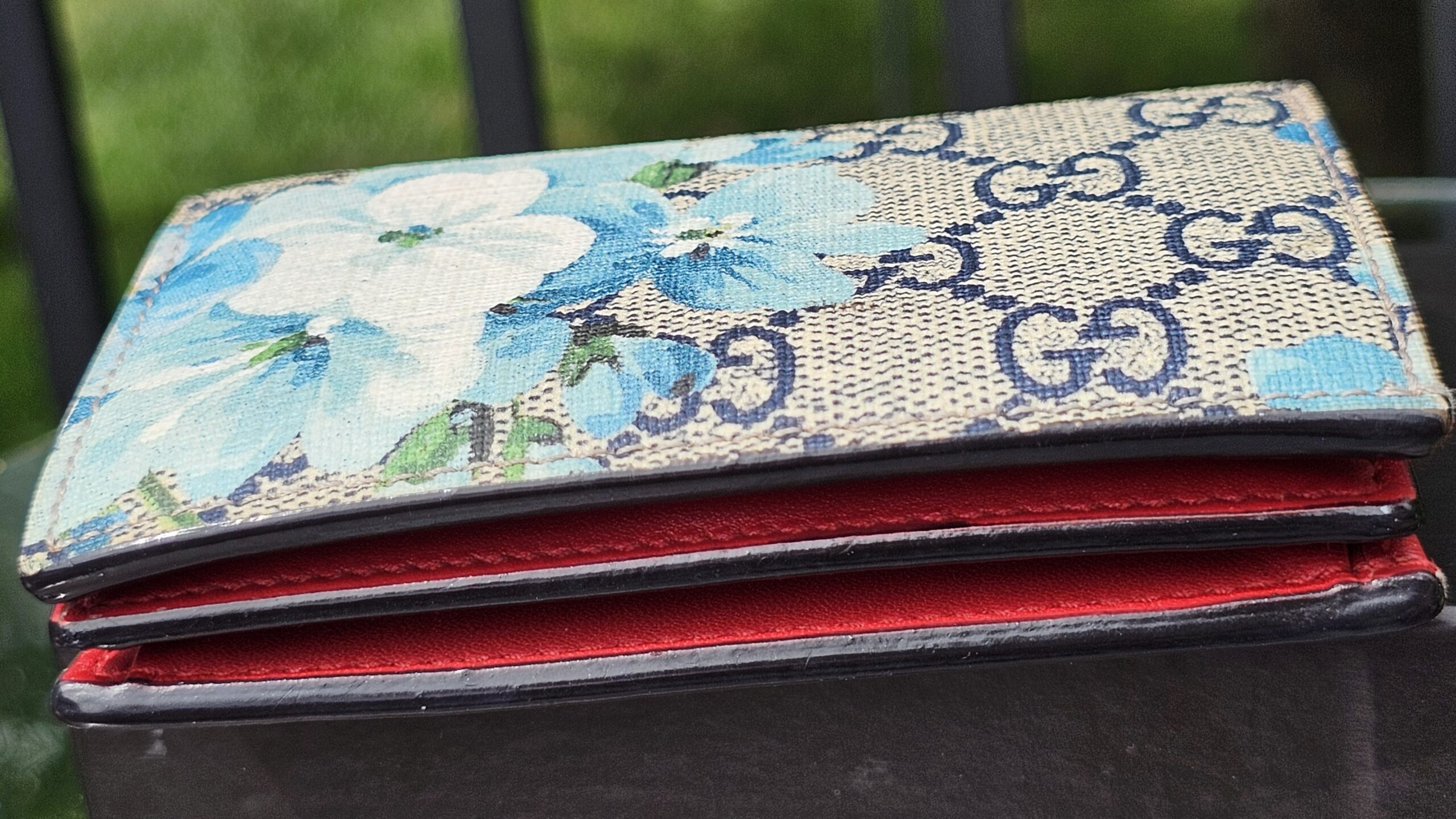 Side profile of the Gucci Blooms compact wallet showing the folded depth