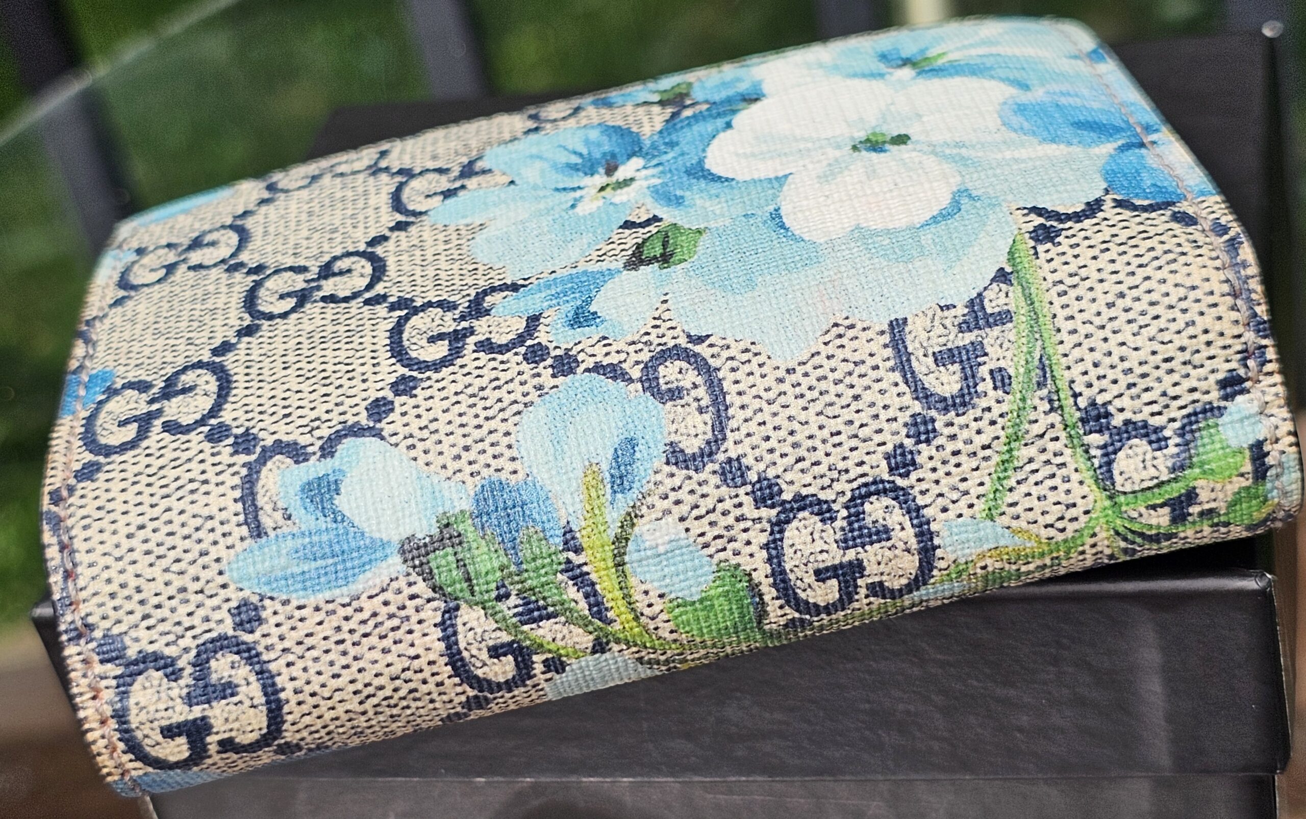 Close-up of the blue Blooms floral print on GG Supreme canvas