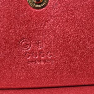 Gucci made in Italy stamp embossed on the red leather interior of the Blooms wallet