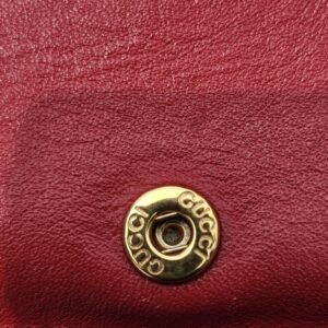 Gold-tone Gucci engraved snap closure inside the Blooms compact wallet