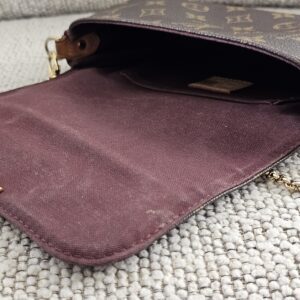 Interior flat pocket of the Louis Vuitton Monogram Favorite PM