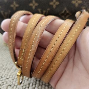 Removable vachetta leather strap for the Louis Vuitton Favorite PM showing patina