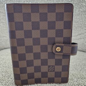 Louis Vuitton Medium Ring Agenda in Damier Ebene canvas with a snap tab closure