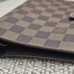 Louis Vuitton Medium Ring Agenda open showing the gold 6-ring hardware