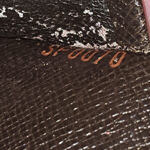 Date code SP0070 stamped inside the Louis Vuitton Medium Ring Agenda, on a peeling area