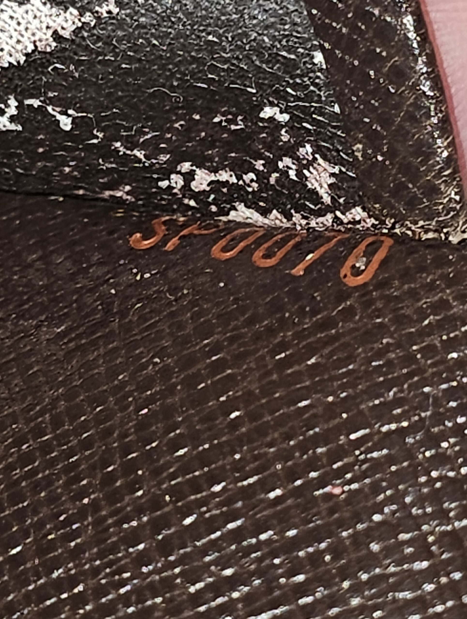 Date code SP0070 stamped inside the Louis Vuitton Medium Ring Agenda, on a peeling area