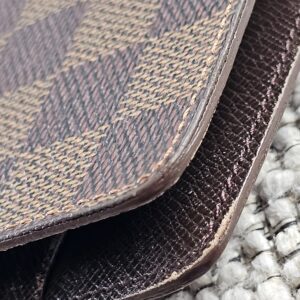 Close-up of the Damier Ebene coated canvas on the Louis Vuitton Medium Ring Agenda