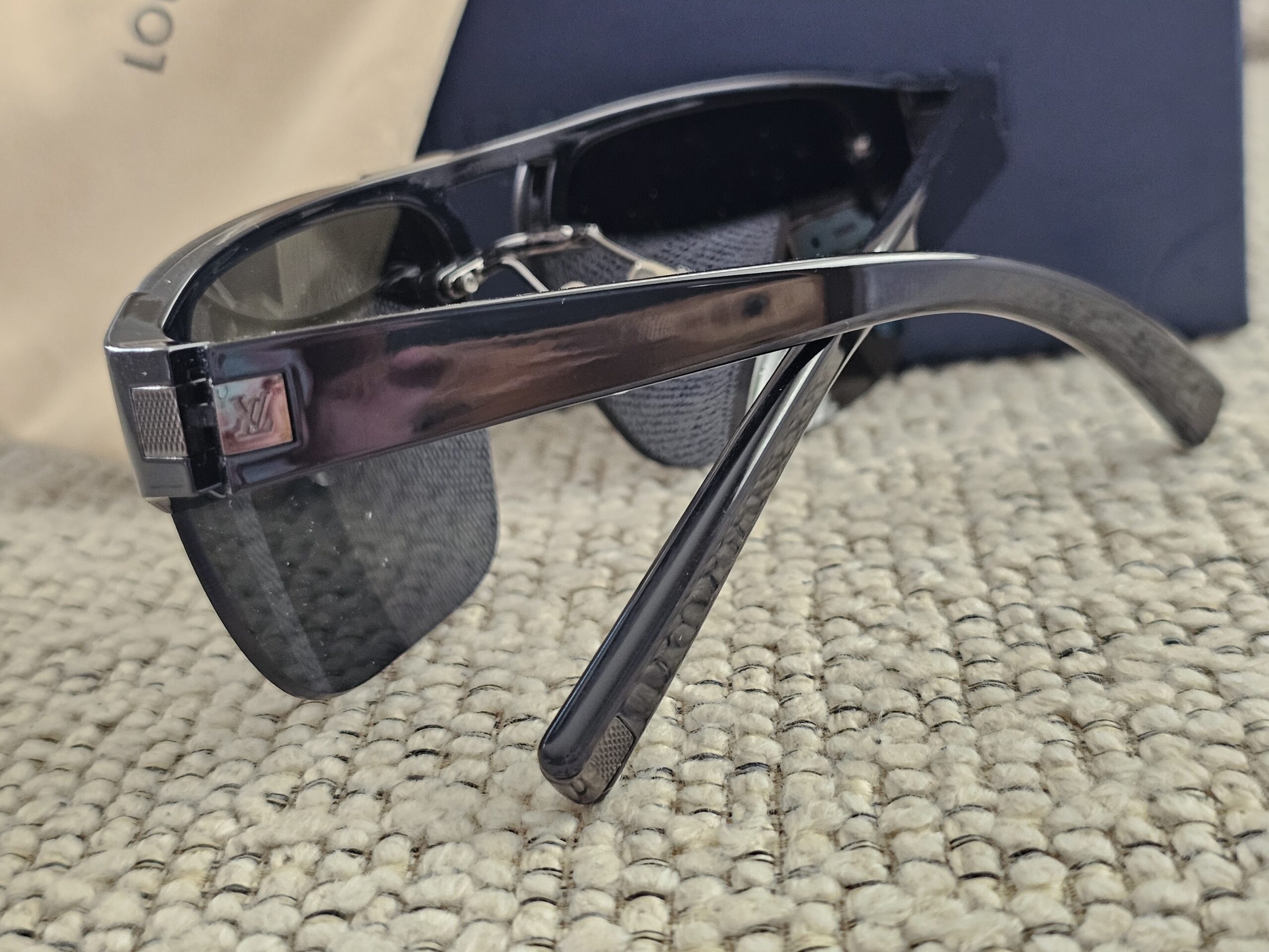 Angled view of the Louis Vuitton Z0527U shield sunglasses showing the flat top frame