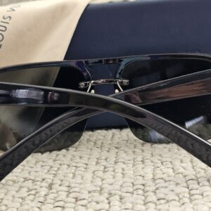 Side view of the black Louis Vuitton Z0527U sunglasses with the arms open