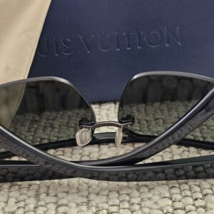 Louis Vuitton Z0527U shield sunglasses folded on the Louis Vuitton case