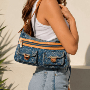 Louis Vuitton Monogram Denim Baggy PM carried on the shoulder, shown for scale and strap drop