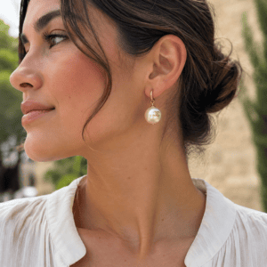 Chanel faux pearl pierced drop earring worn, shown for scale and styling