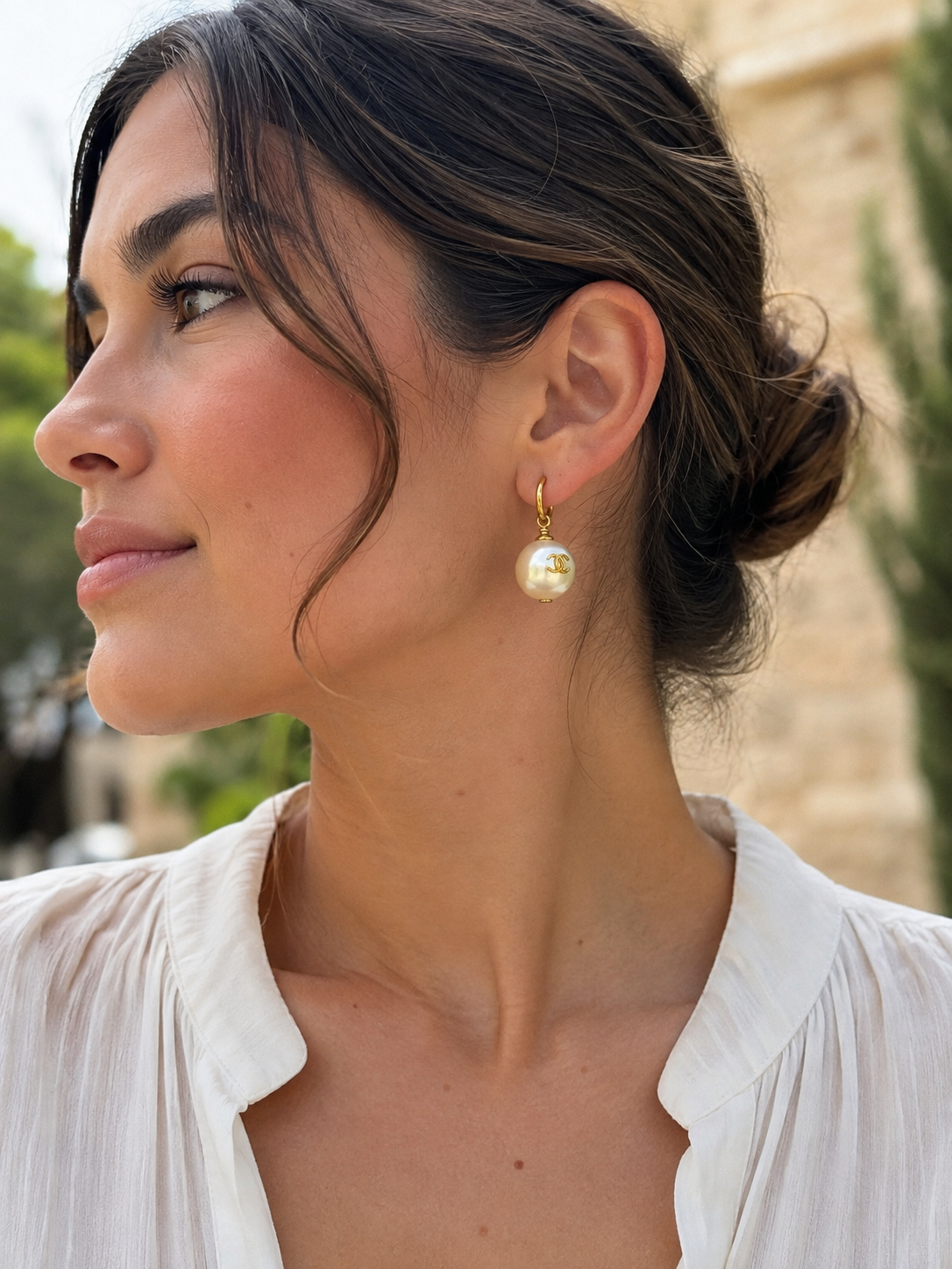 Chanel faux pearl pierced drop earring worn, shown for scale and styling
